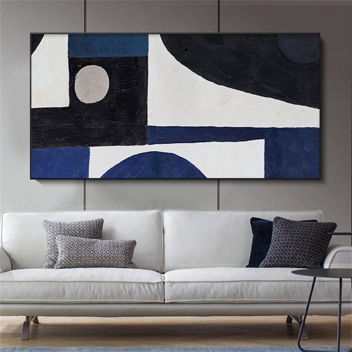 Room mockup. Black and navy blocks, a small pale circle and broad curved white fields form a bold geometric composition.