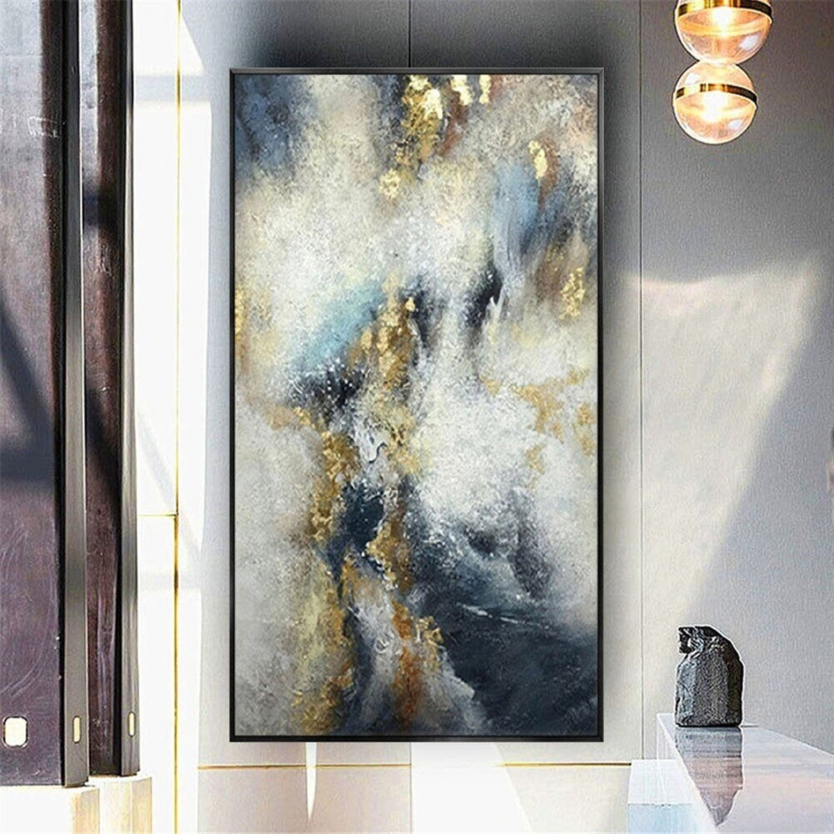 Room mockup. Cloud-like white and cream strokes cross deep navy and grey fields with scattered gold-coloured textured patches.