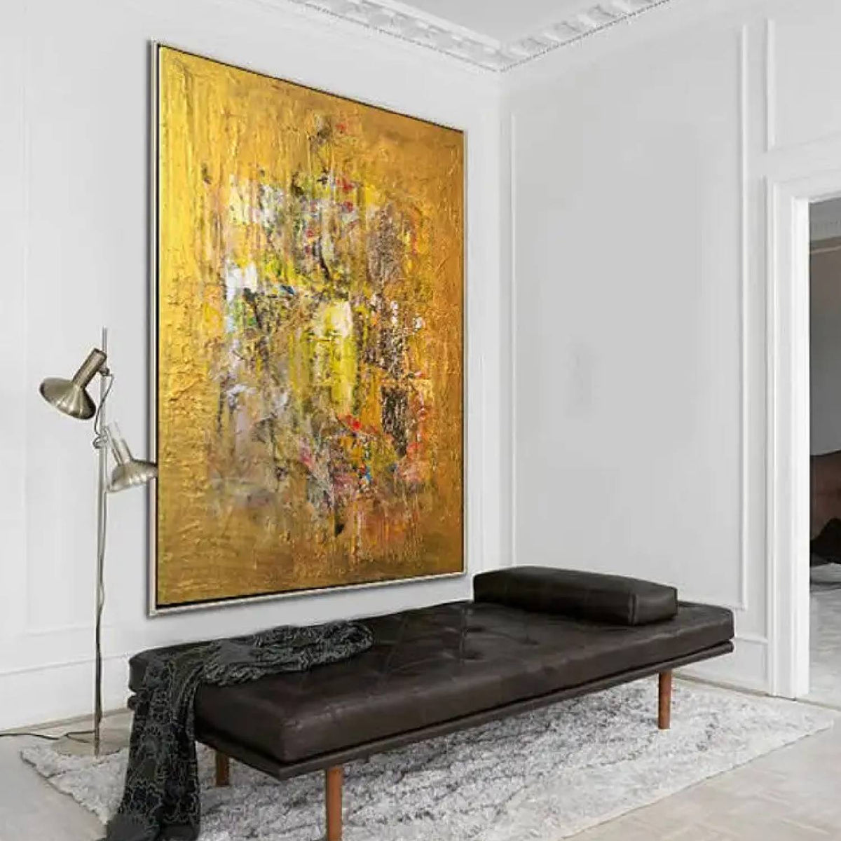 Room mockup. An ochre and yellow textured field with a dense central cluster of grey, cream, rust and dark scraped marks.