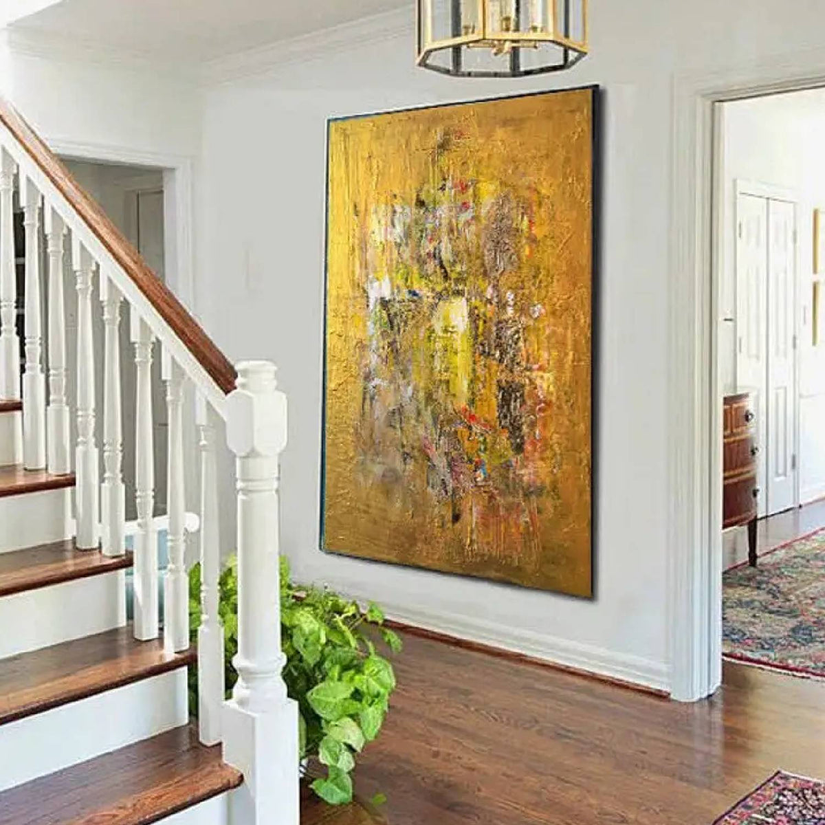 Room mockup. An ochre and yellow textured field with a dense central cluster of grey, cream, rust and dark scraped marks.