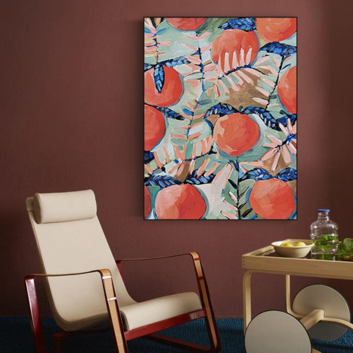 Room mockup. Large orange-red fruits and pale pink and green tropical leaves overlap dark blue stems in a dense decorative pattern.