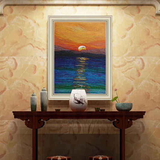 Room mockup. A low yellow-white sun above a dark horizon, reflected in blue water beneath a sweeping orange and red sky.