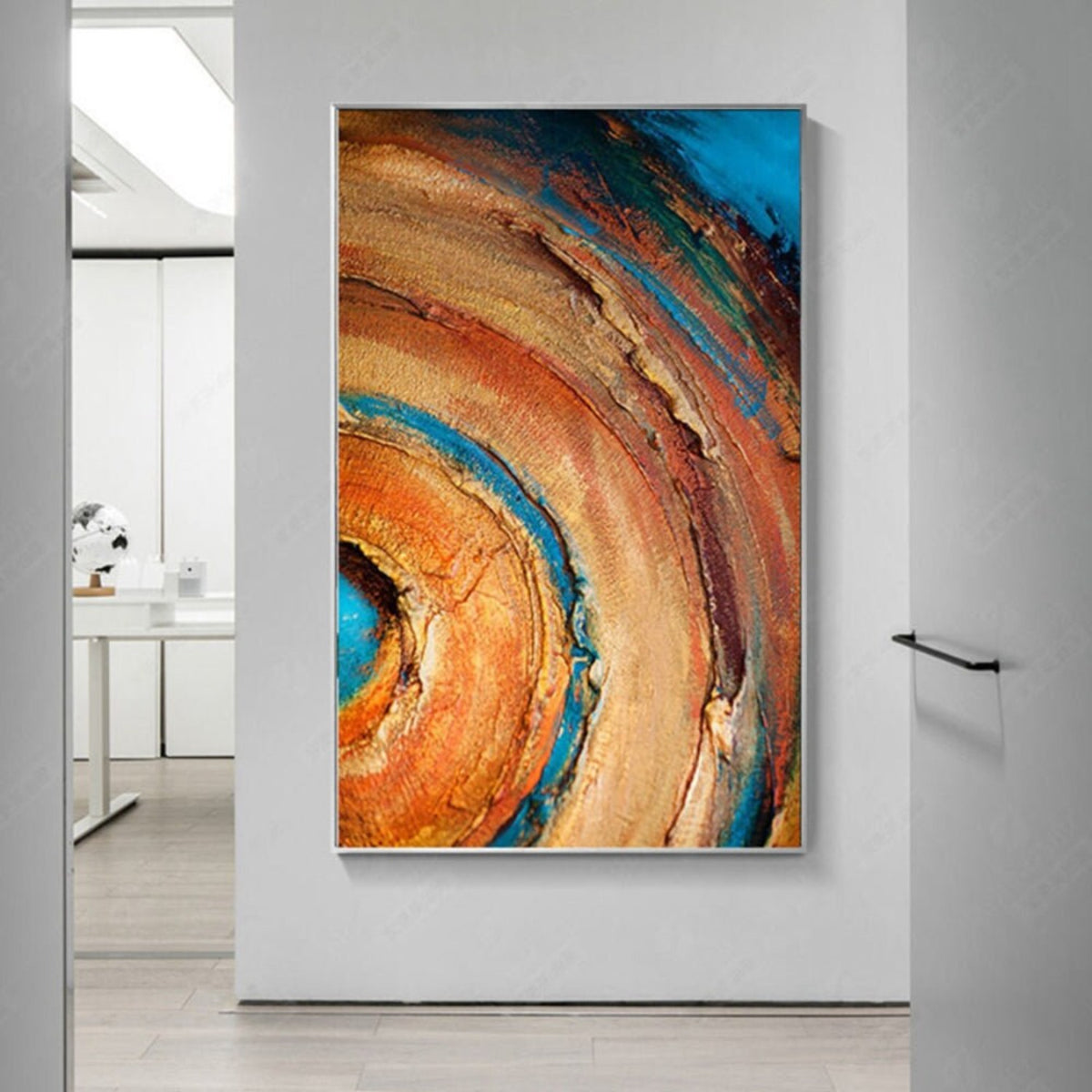 Room mockup. Broad concentric orange, ochre and rust arcs curve around a turquoise centre, with dark blue outer patches and rough texture.