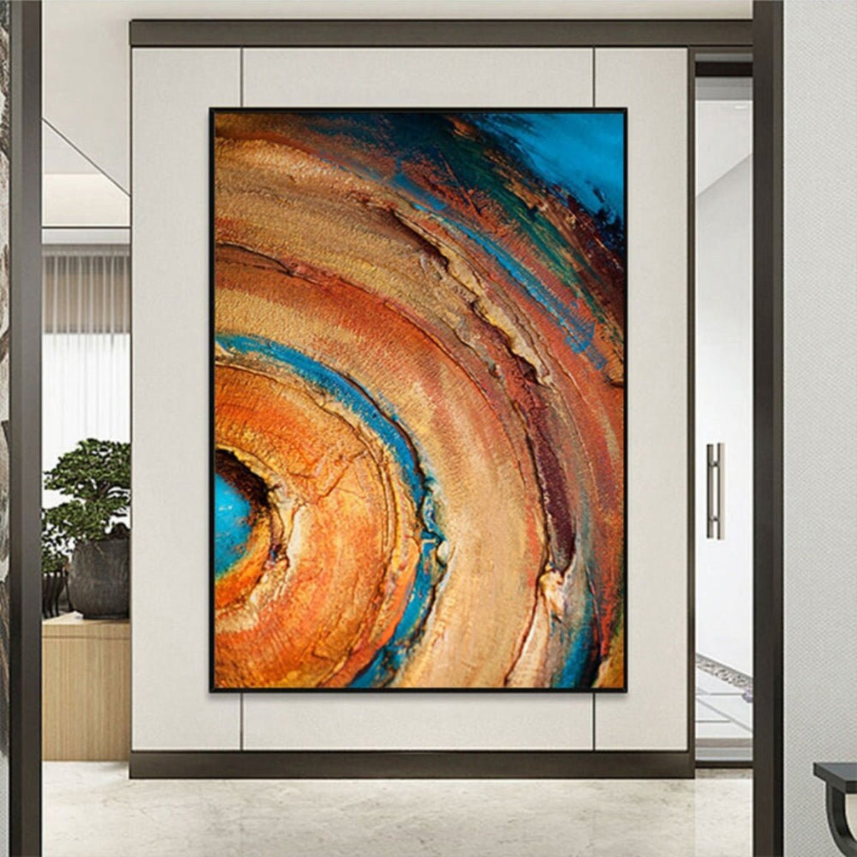 Room mockup. Broad concentric orange, ochre and rust arcs curve around a turquoise centre, with dark blue outer patches and rough texture.