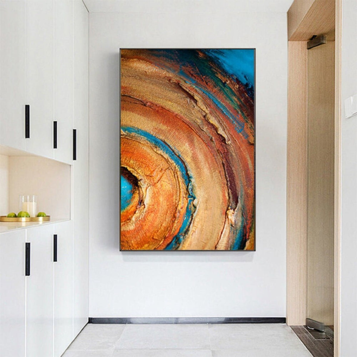 Room mockup. Broad concentric orange, ochre and rust arcs curve around a turquoise centre, with dark blue outer patches and rough texture.