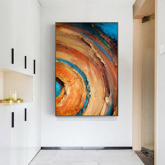 Room mockup. Broad concentric orange, ochre and rust arcs curve around a turquoise centre, with dark blue outer patches and rough texture.