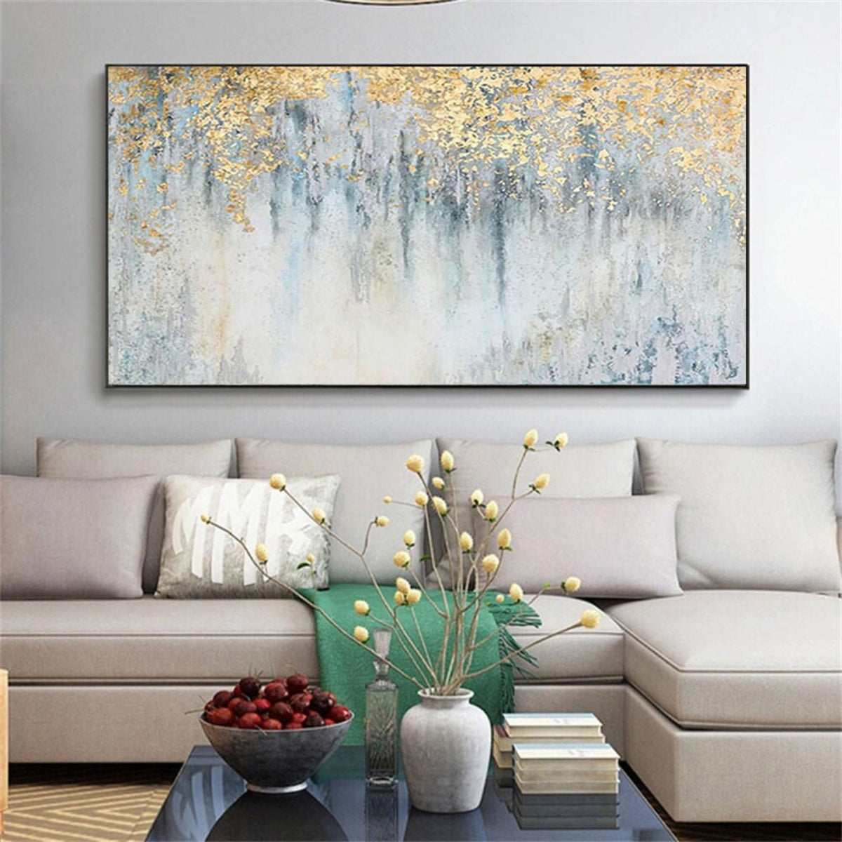 Room mockup. Gold-coloured textured foliage-like marks hang over fine dark vertical drips on a pale blue and white field.