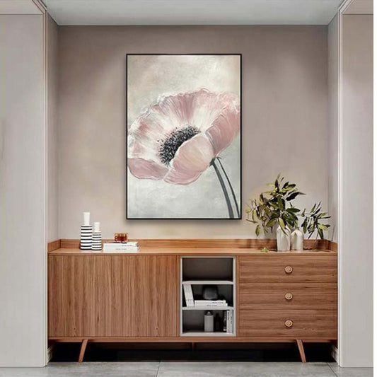 Room mockup. A large pale pink poppy with a textured black centre and two slender dark stems against soft grey-white.