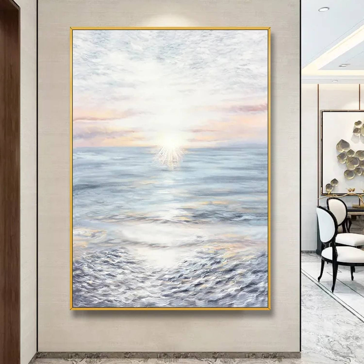 Room mockup. A pale sun near the horizon casts a bright reflection across blue-grey water beneath a softly pink and white sky.
