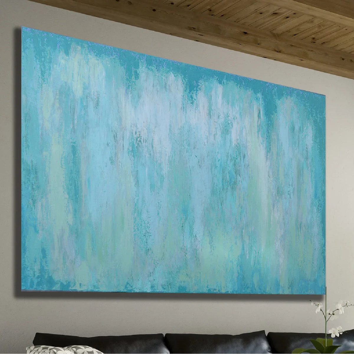 Room mockup showing pale turquoise and white abstract painting with soft washes and faint vertical streaks.