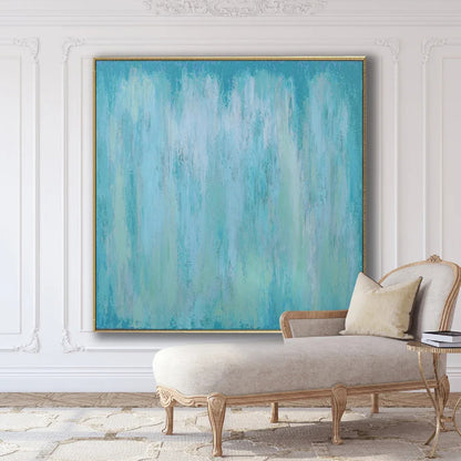 Room mockup showing pale turquoise and white abstract painting with soft washes and faint vertical streaks.