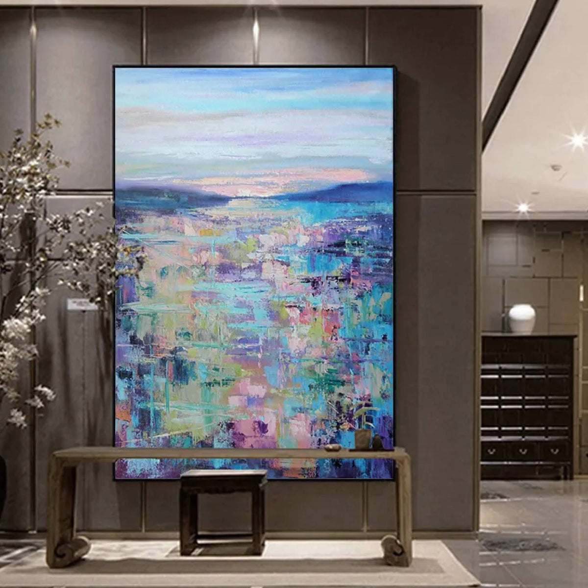 Room mockup. Pastel blue, pink, mint and purple textured patches below low blue hills and a pale softly striped sky.