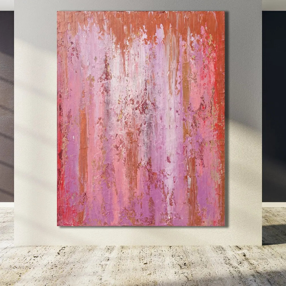 Room mockup showing pink and purple abstract painting with fine vertical drips, red accents and a narrow orange upper band.