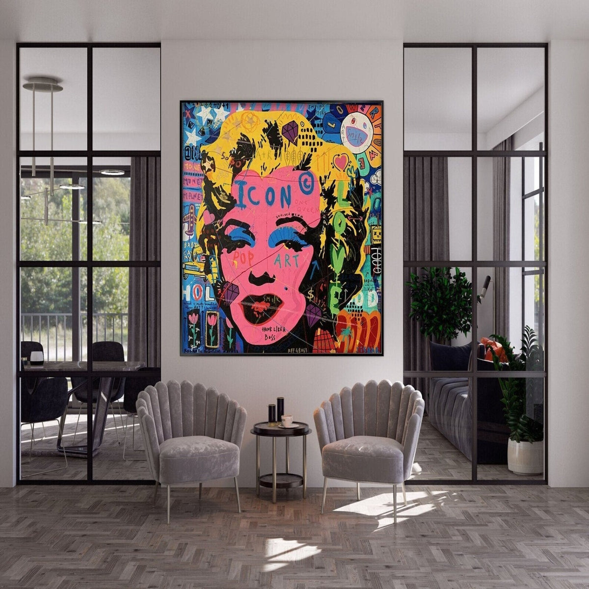 Room mockup. Marilyn Monroe portrait with a bright pink face, yellow hair and black outlines amid colourful graffiti lettering.