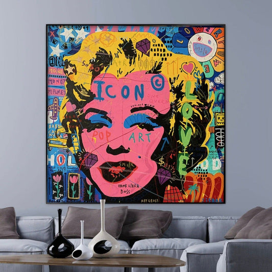 Room mockup. Marilyn Monroe portrait with a bright pink face, yellow hair and black outlines amid colourful graffiti lettering.