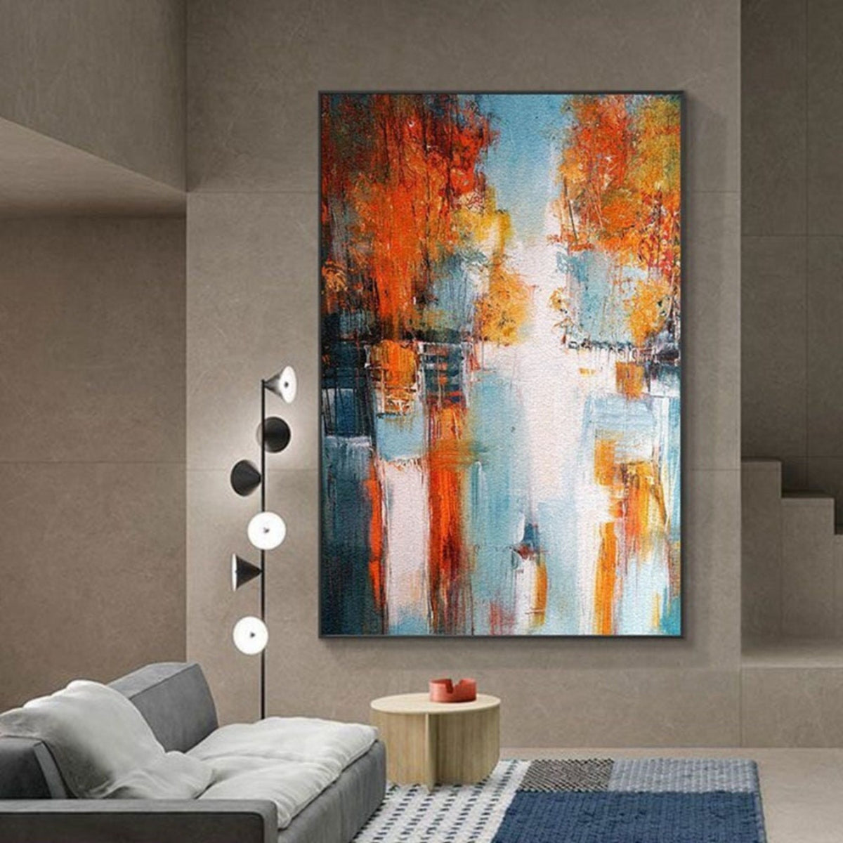 Room mockup. Abstract artwork with dense rust-orange patches, dark teal accents and a pale blue and white passage with drips.