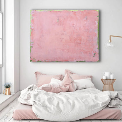 Room mockup showing soft pink abstract painting with a mottled surface and thin pale green edging.
