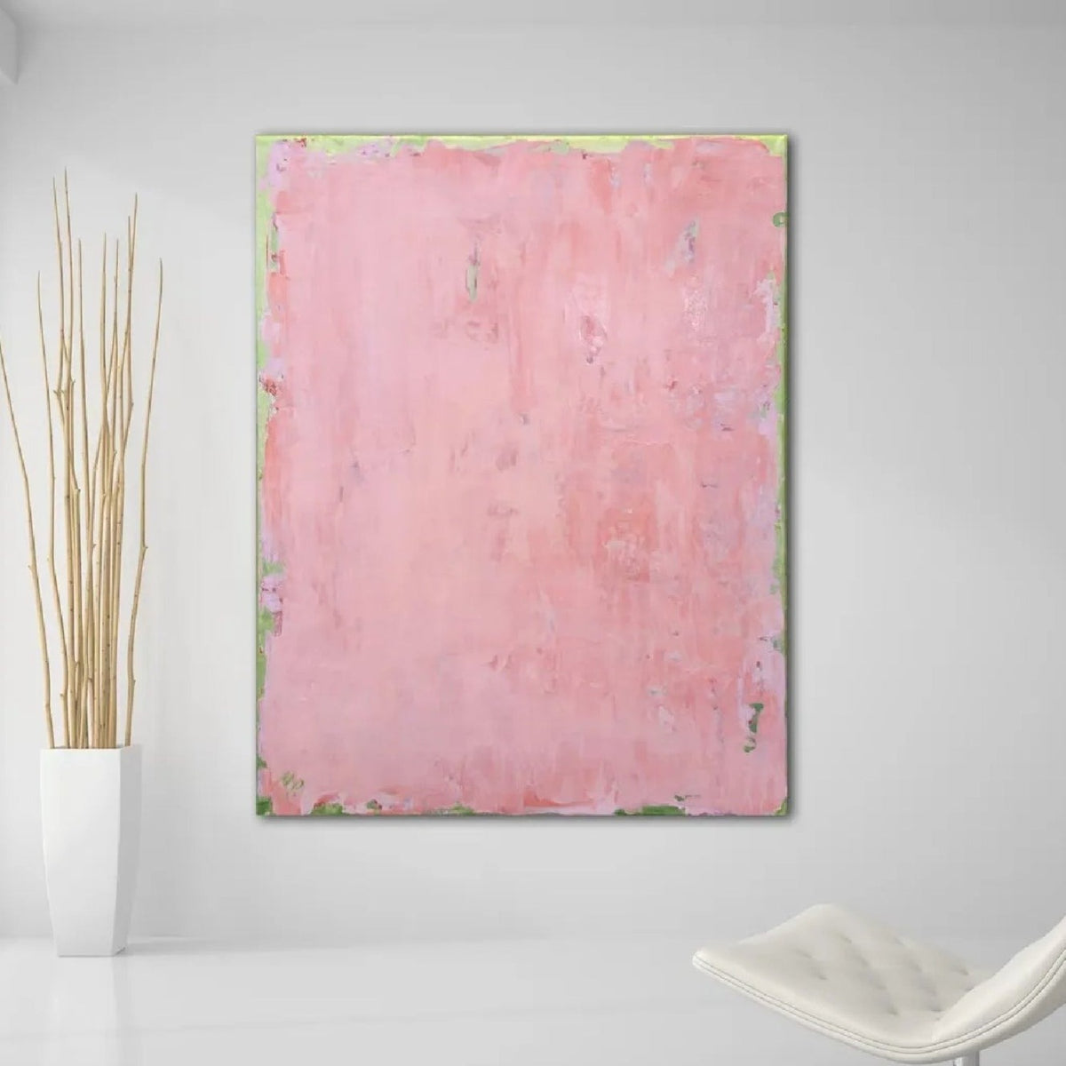 Room mockup showing soft pink abstract painting with a mottled surface and thin pale green edging.