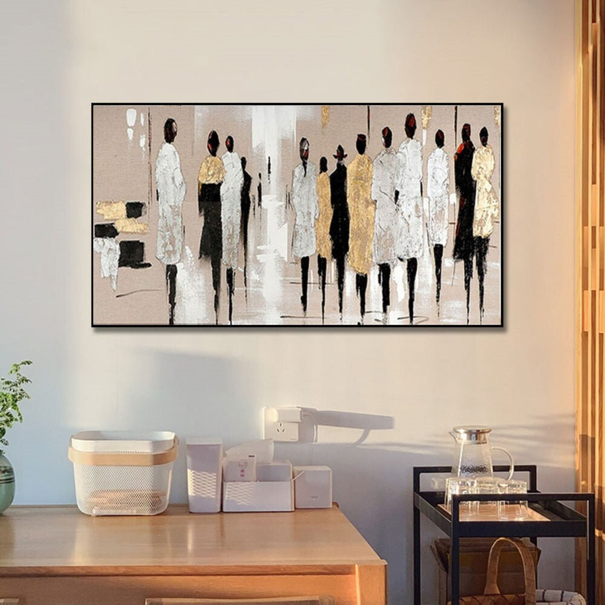 Room mockup. A line of elongated figures in white, black and gold-coloured clothing against a soft beige and pale grey field.