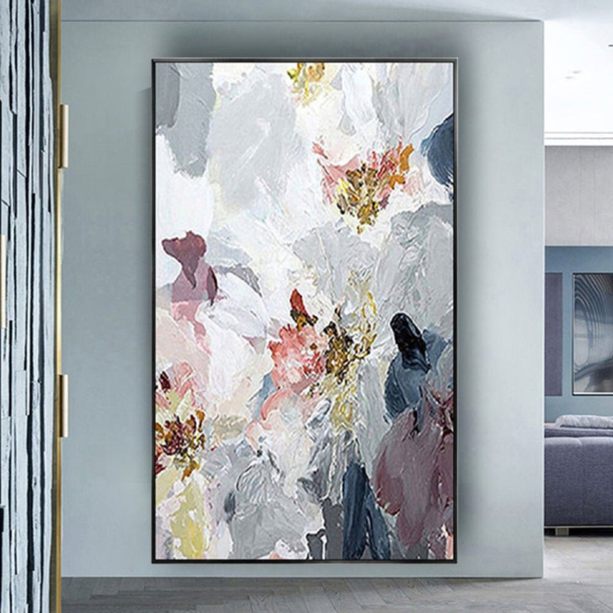 Room mockup. Large white textured flower-like forms overlap grey, muted pink and navy patches with small ochre centres.
