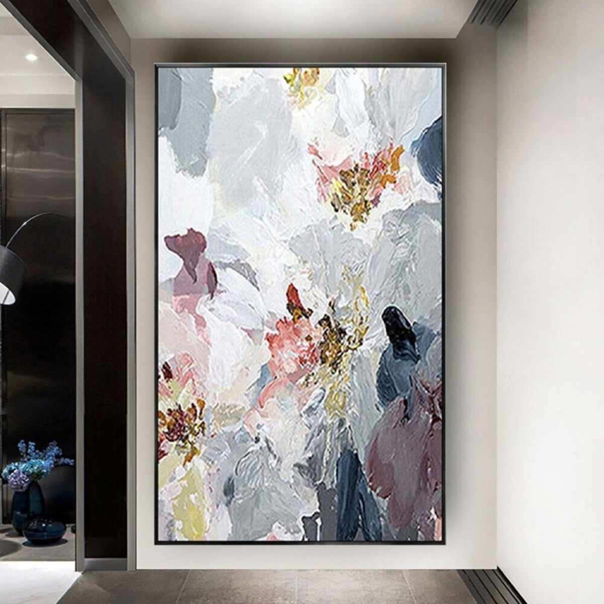 Room mockup. Large white textured flower-like forms overlap grey, muted pink and navy patches with small ochre centres.