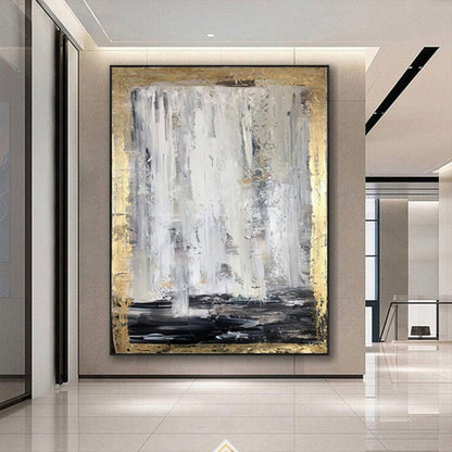 Room mockup. Long white and grey vertical strokes fall toward a black lower band, bordered by rough gold-coloured texture.