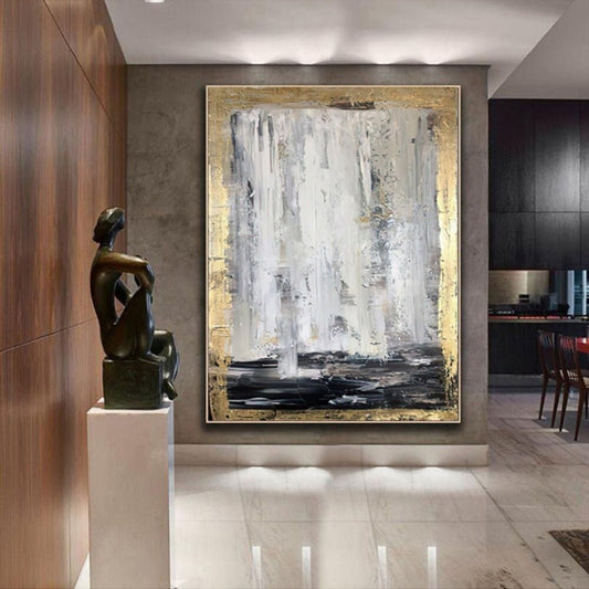 Room mockup. Long white and grey vertical strokes fall toward a black lower band, bordered by rough gold-coloured texture.