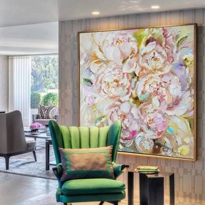 Room mockup. Large loose white and pale pink peony blooms with green and ochre accents against a warm light background.