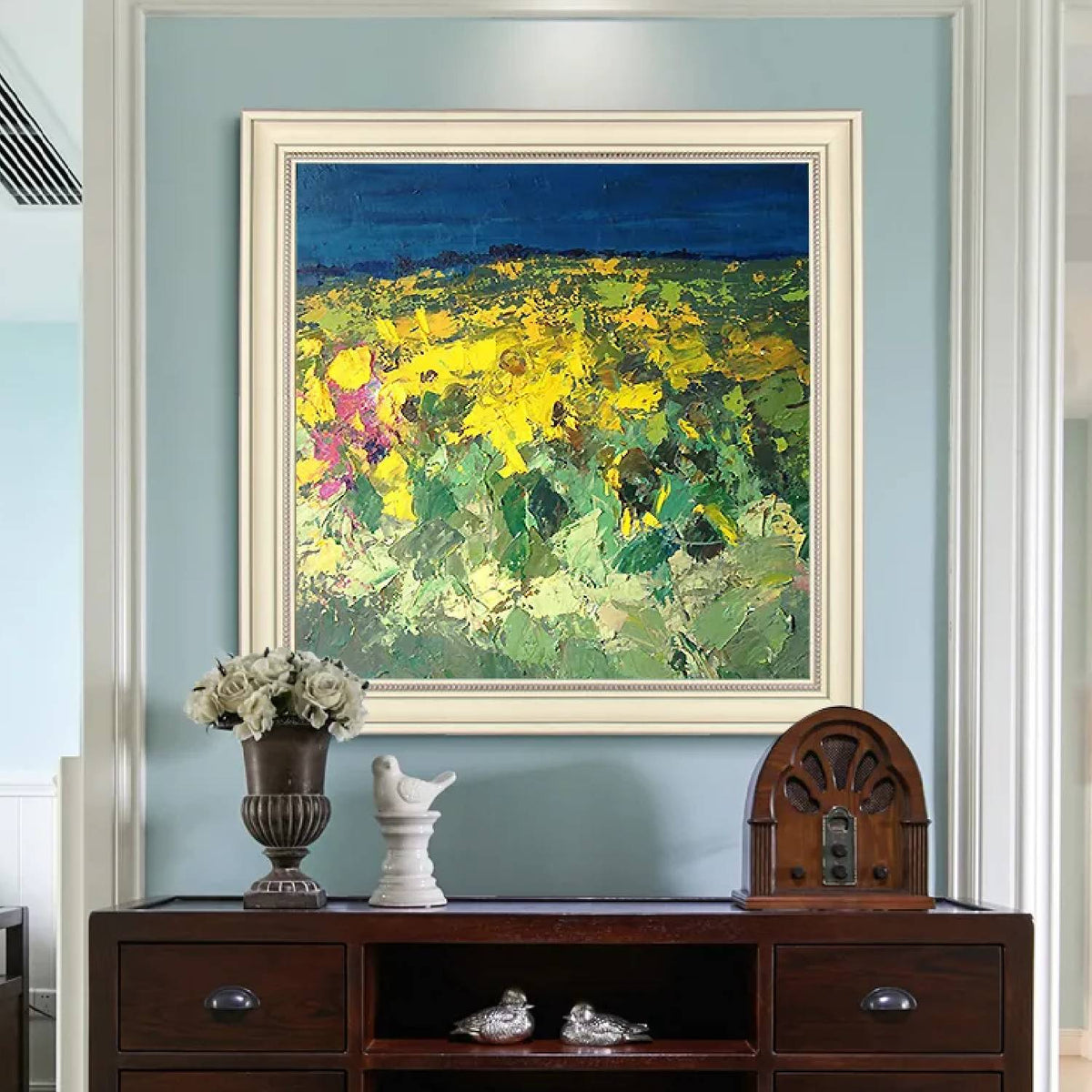 Room mockup. Thick yellow flower-like dabs and green foliage fill a field below a deep blue horizontal sky.