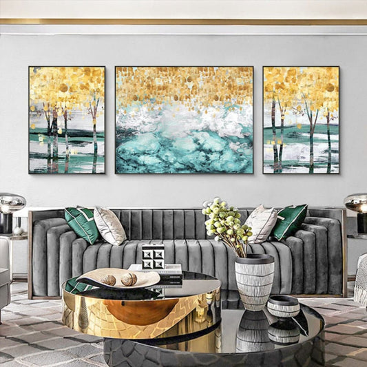 Room mockup. Three-panel artwork with yellow trees, thin black trunks and dense white and turquoise strokes.